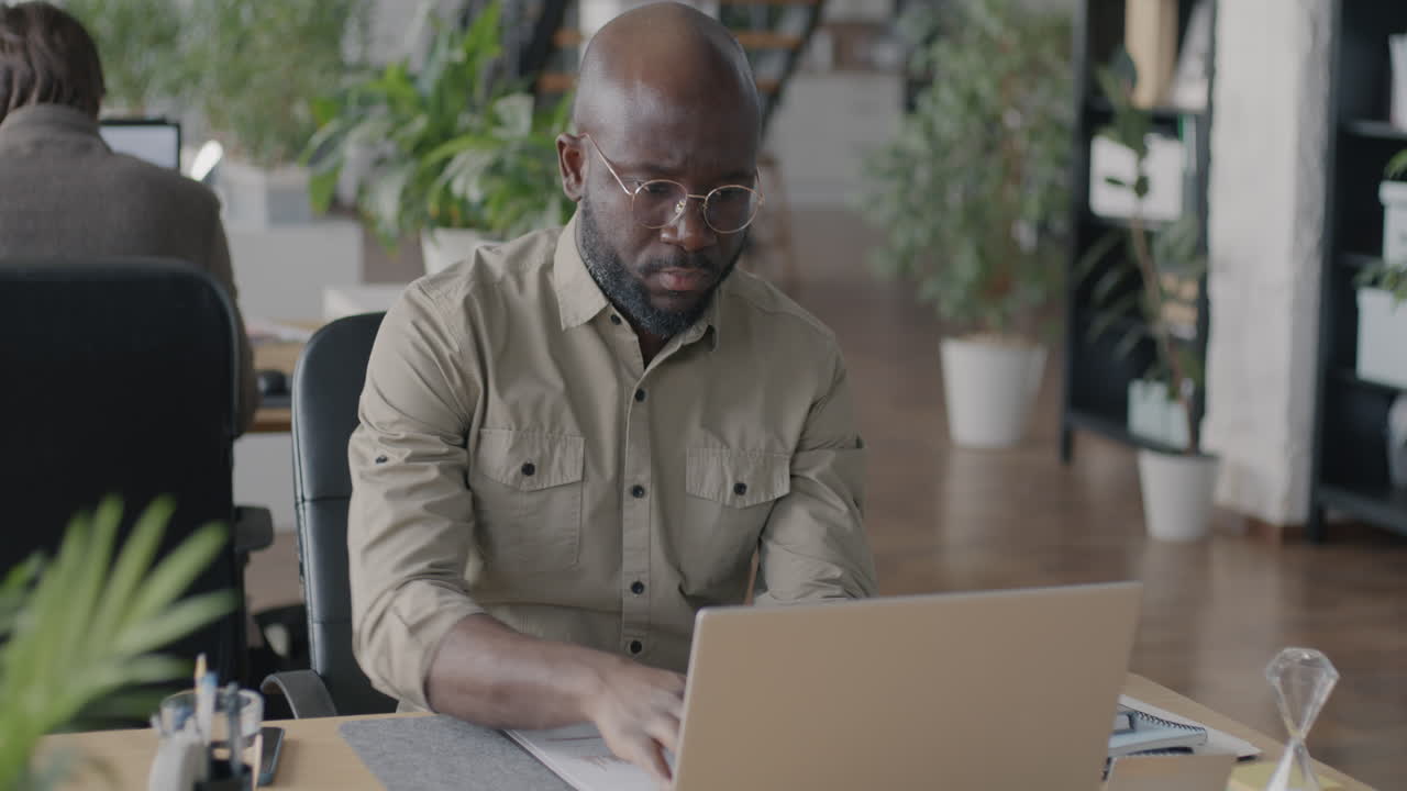 Businessman working on laptop in office