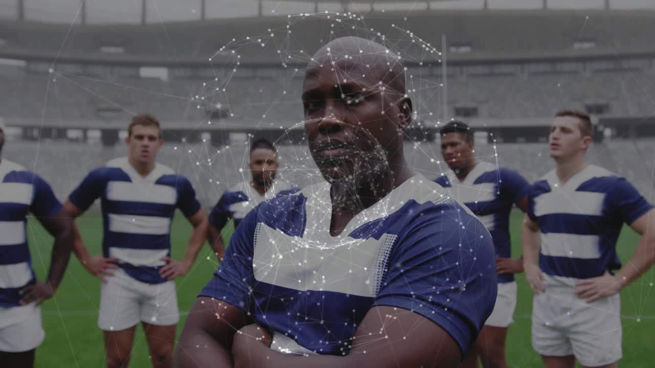Sex rugbyspelare på planen, uppställningen initierar ett glödande nätverksöverlägg som visualiserar lagsammanhållning.