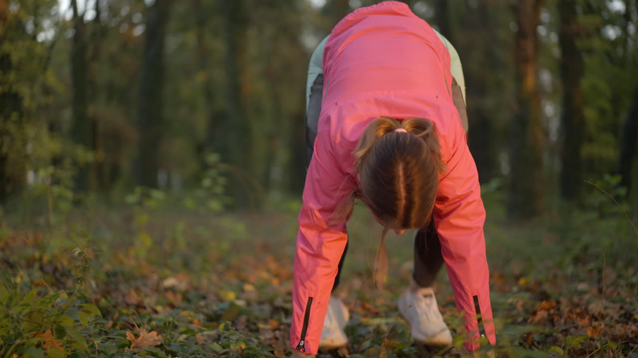 Woman Exercising Outdoors in a Park