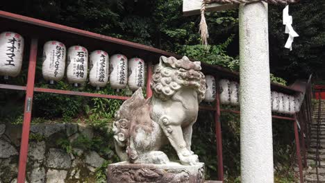 lion statue in kyoto shrine entrance, sculpture of temple guardian japan, japanese travel destination