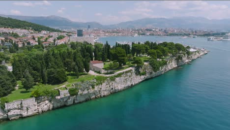 a gentle arcing shot around sustipan park on the edges of split, croatia on a bright afternoon