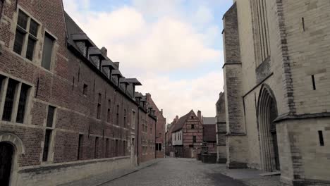 Tracking-shot-at-the-Sint-Jan-de-Doperkerk-in-the-beguinage-of-Leuven,-Belgium