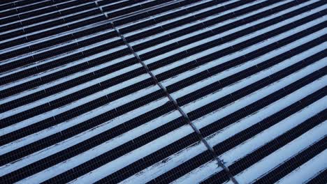 A-snow-covered-field-with-non-operational-solar-panels-during-a-Canadian-winter