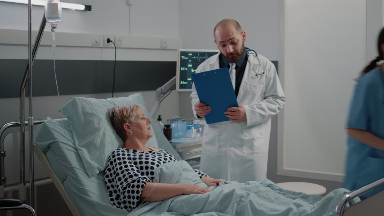 Doctor and nurse doing consultation with oximeter for ill woman