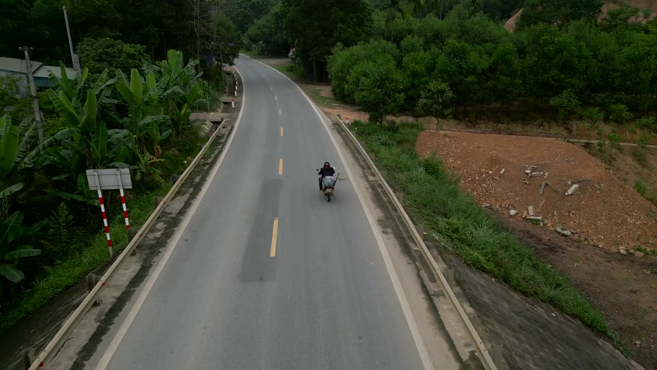Motorcycle on a Rural Road Bridge