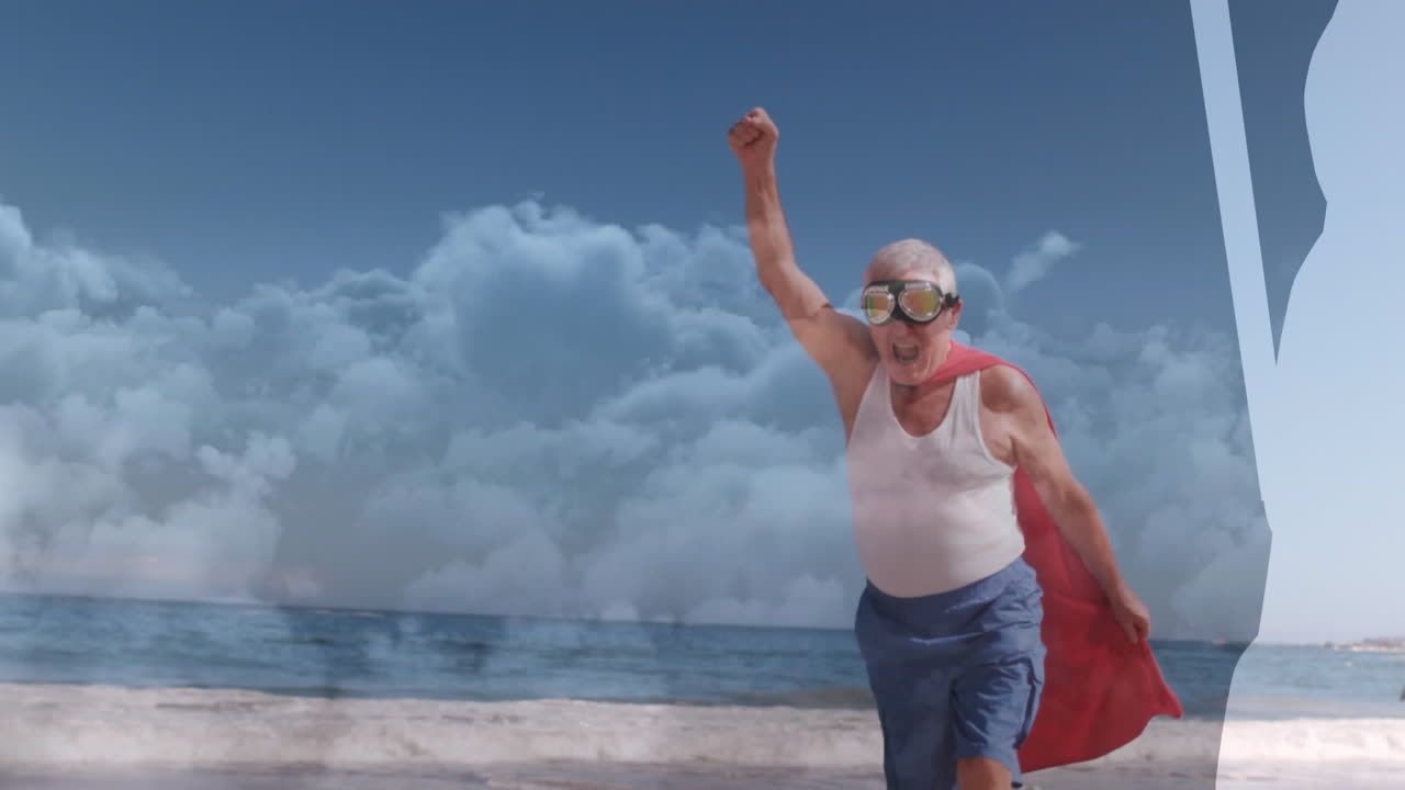 animación de nubes sobre un hombre caucásico mayor vestido con disfraz de superhéroe en la playa