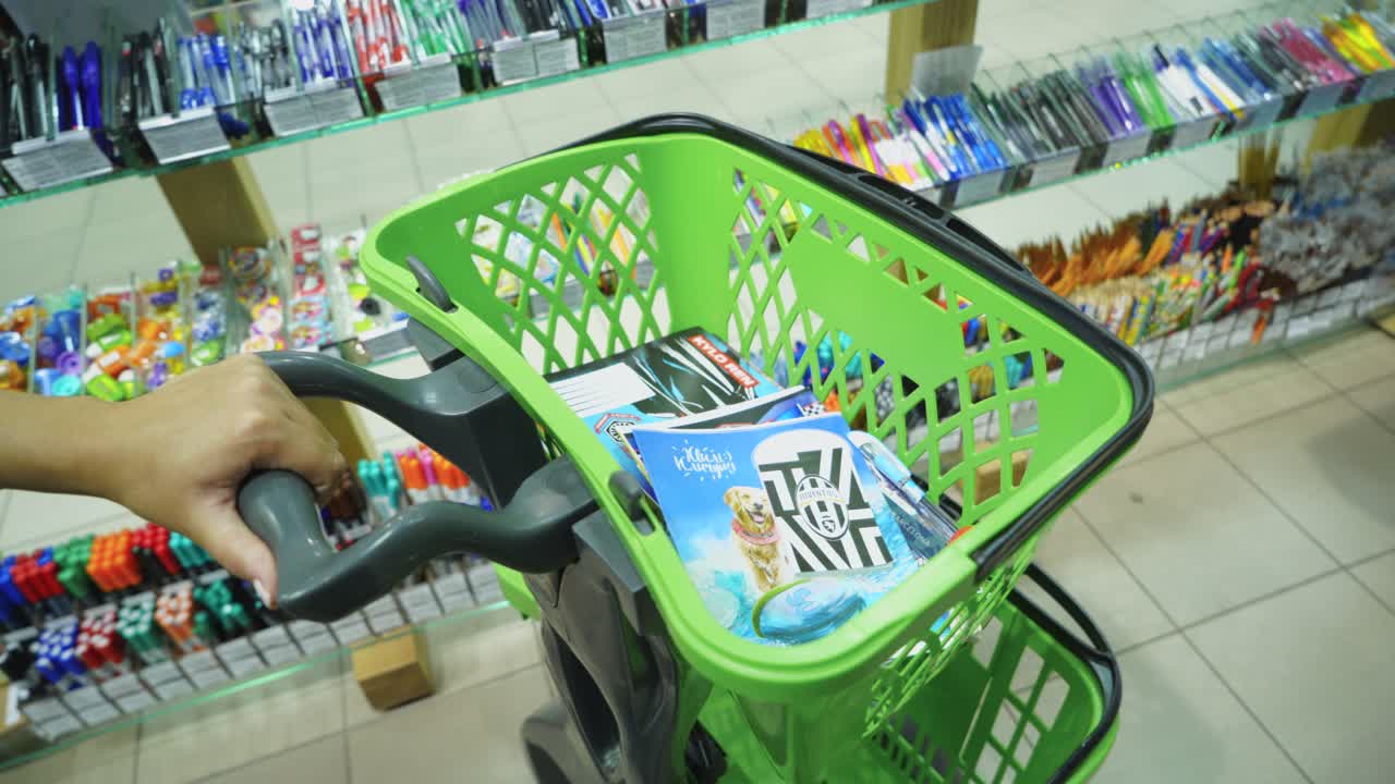 VINNITSA, UKRAINE - AUGUST 20, 2018: Back to school concept, shopping cart at stationery department in Shopping Center
