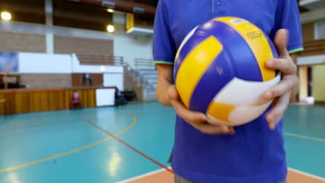 female volleyball player holding a volleyball 4k