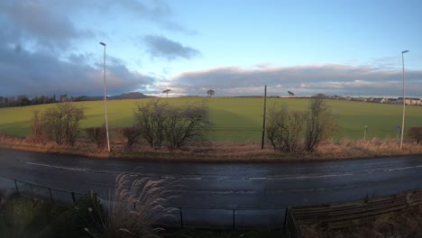 Timelapse-of-busy-countryside-road-as-clouds-move-above