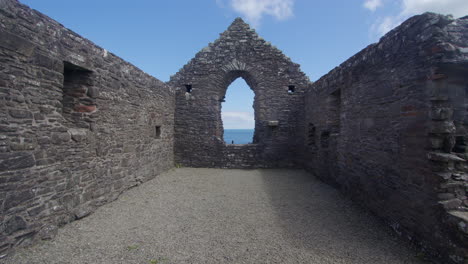 wide shot looking at the east end window inside of st ninian’s chapel, isle head, isle of whithorn