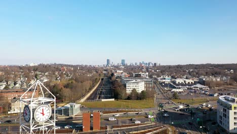 Aerial-shot-flying-over-shopping-mall-next-to-a-busy-street-in-the-early-morning-in-Boston