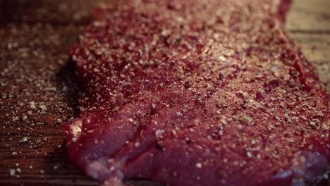 mixed pepper and spices on the raw meat steak