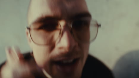 man with glasses and expression