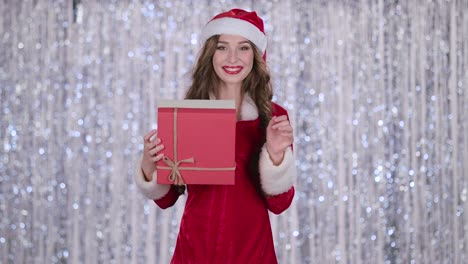 woman in santa costume holding a present