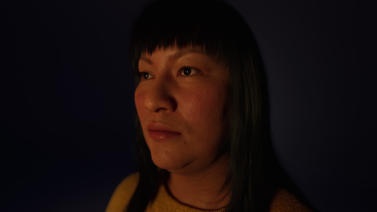 adult Mexican lady portrait in the dark