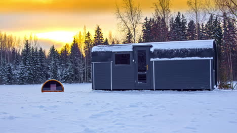 sustainable solitary cabin house in snow covered winter landscape