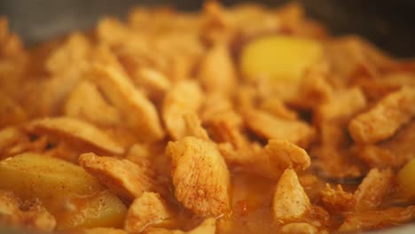 chicken and potatoes being cooked