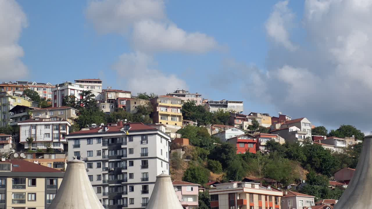 Residential buildings on a hillside in a city