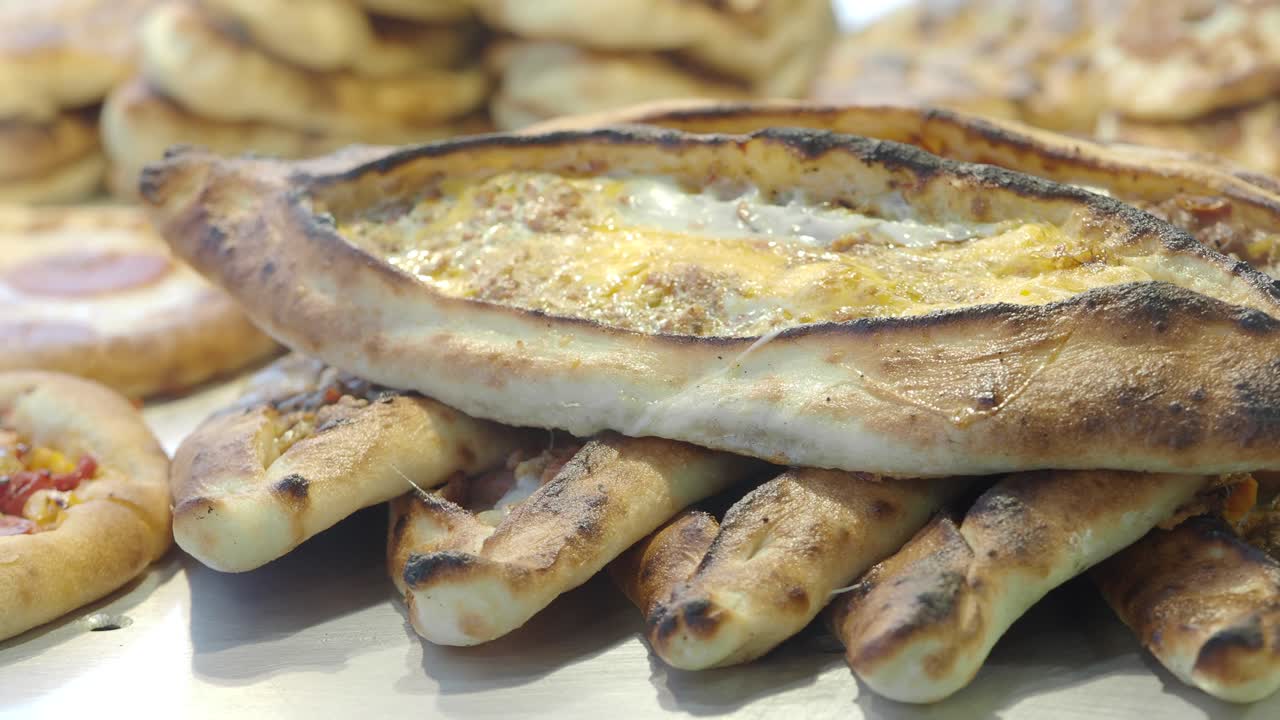 Delicious Turkish Pide Flatbreads with Cheese and Egg Topping