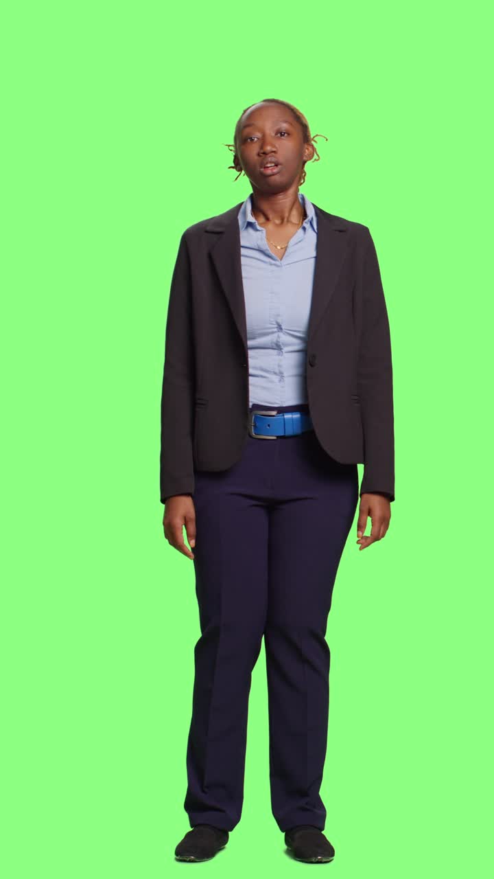 Vertical video: Disappointed business woman on suit standing over background