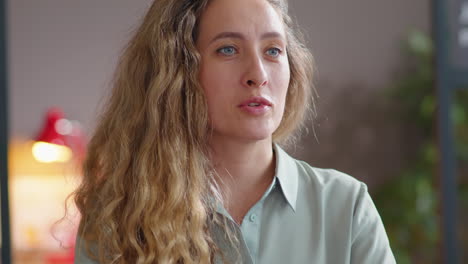 businesswoman smiling and speaking on job interview