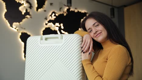 woman packing clothes into suitcase for summer travel. journey preparation