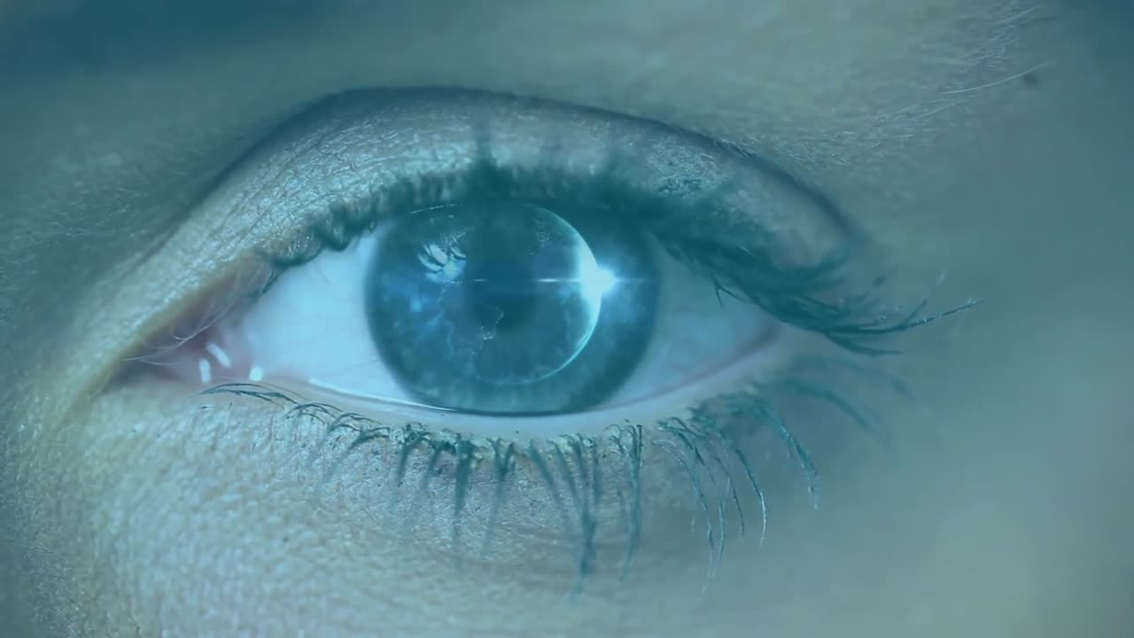 Animation of woman's eye opening and closing with scrolling white digital information