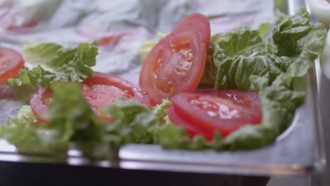 close up shot of the greens and tomatoes