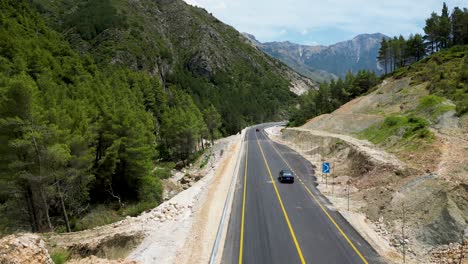 Small-mountain-road-with-beautiful-scenery-and-forest-on-both-sides