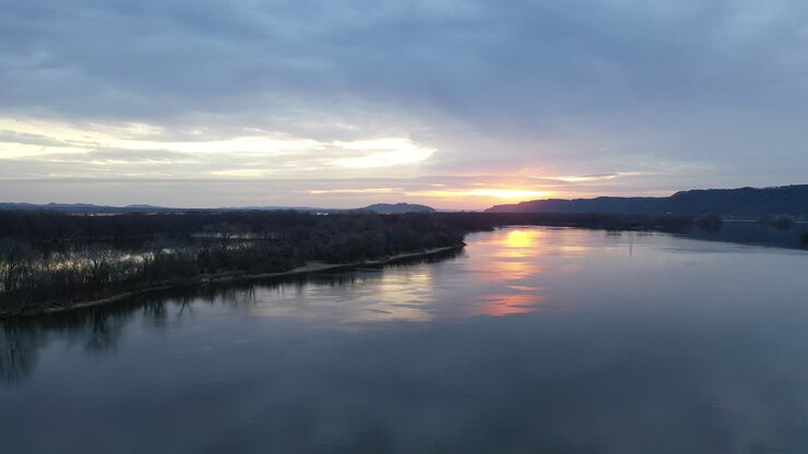 Sunrise over a River with Islands and Hills