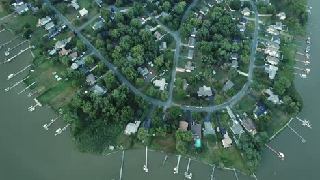 birdseye aerial view of kent island coast, houses and docks