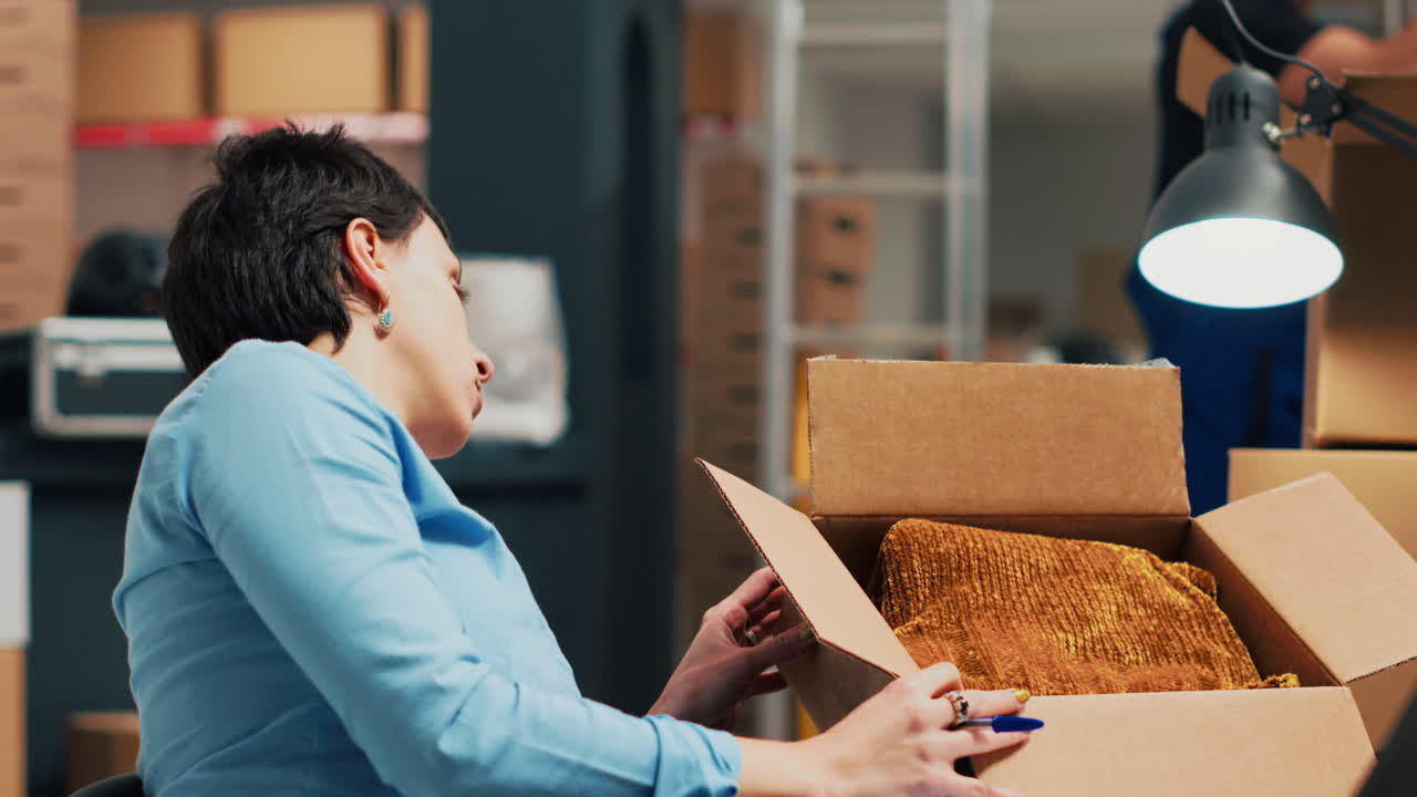 Woman packing items in a box