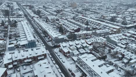 Aerial-top-down-of-snowy-american-town-with-row-of-houses-in-winter-season