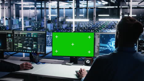 data center engineer using green screen pc to monitor neural network using ai