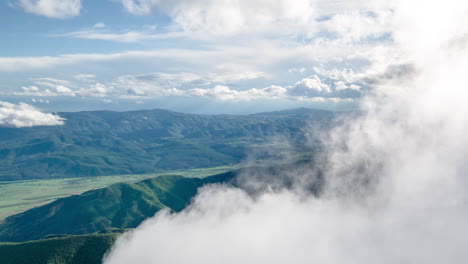 mountainous landscape with clouds and fog