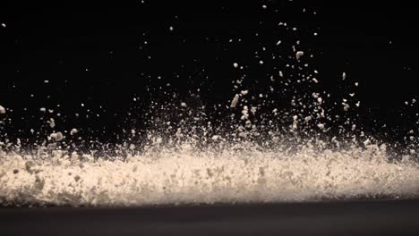 White-Powder-explosion-on-black-surface-super-slow-motion-800fps-high-speed