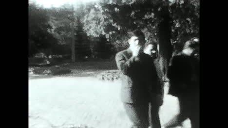 historical black and white footage of people and military cannons