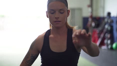 female athlete performing leg stretches before a workout