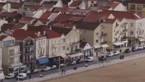 street along nazare beach in portugal, long telephoto view of houses and everyday life