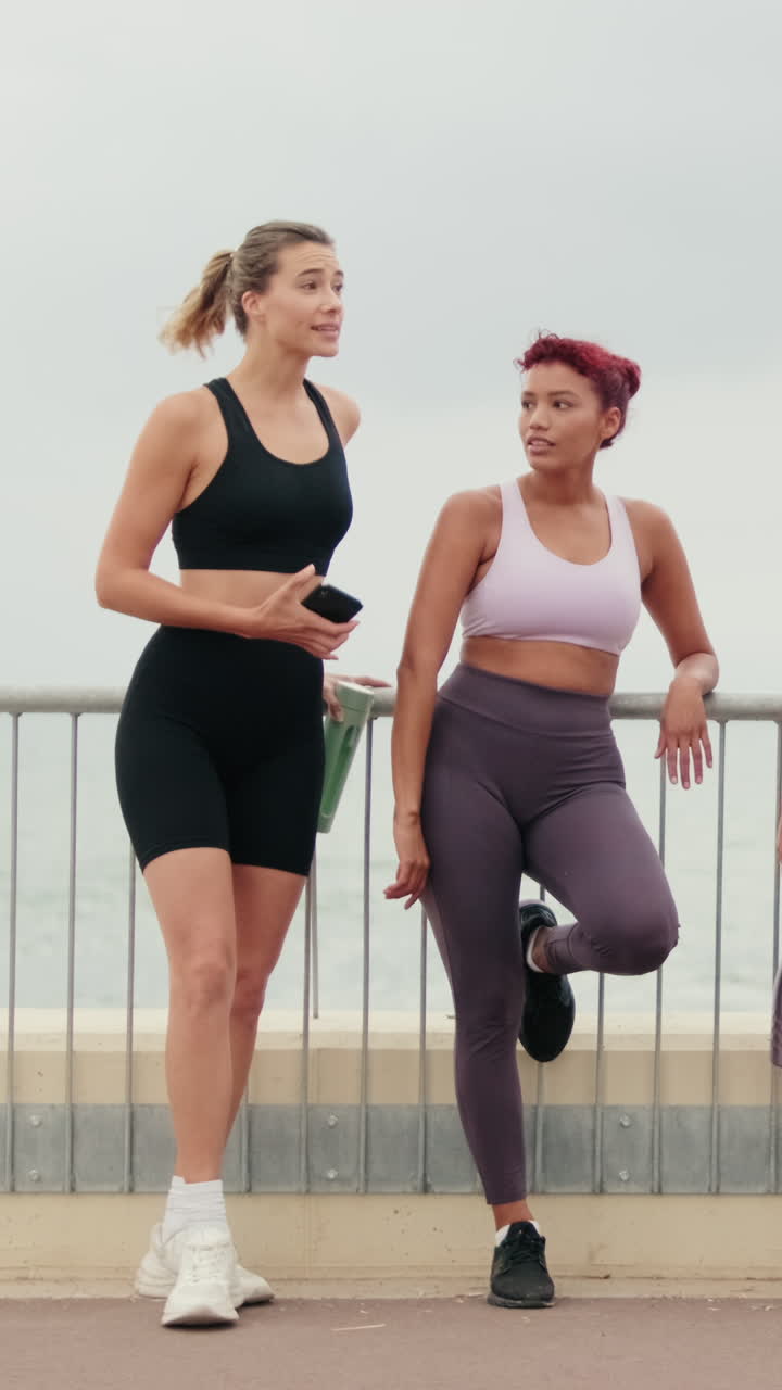 Female Friends Chat After Beach Workout