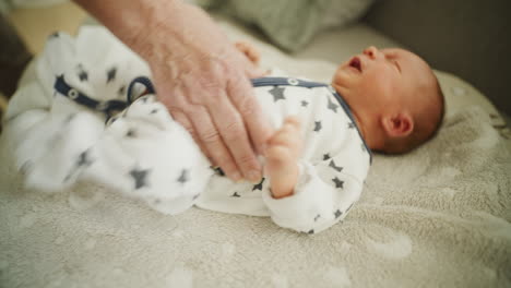 midwife massaging newborn for colic relief