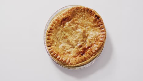 video of pie seen from above on white background