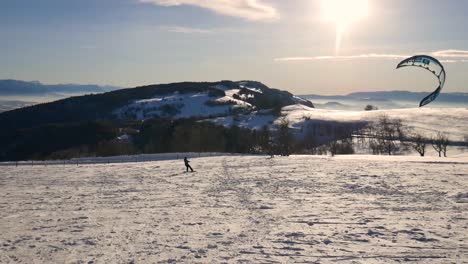 Person-Kite-Skiing-on-a-Snow-Covered-Plain-in-the-French-Alps-on-a-Clear-Day-2