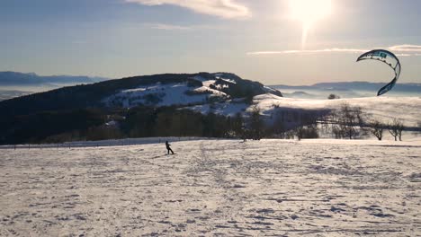 person kite-skiing on a snow covered plain in the french alps on a clear day 2