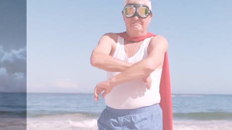 Animation-of-clouds-over-senior-caucasian-man-wearing-superhero-costume-on-beach