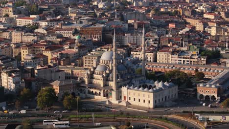 orbiting drone shot above yeni cami mosque in istanbul, turkey. summer day