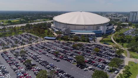 4k aerial drone video of tropicana field and full parking lot in downtown st