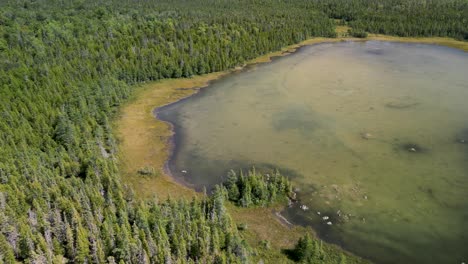 Aerial-pan-of-wilderness-lake,-Les-Cheneaux-Islands,-Michigan