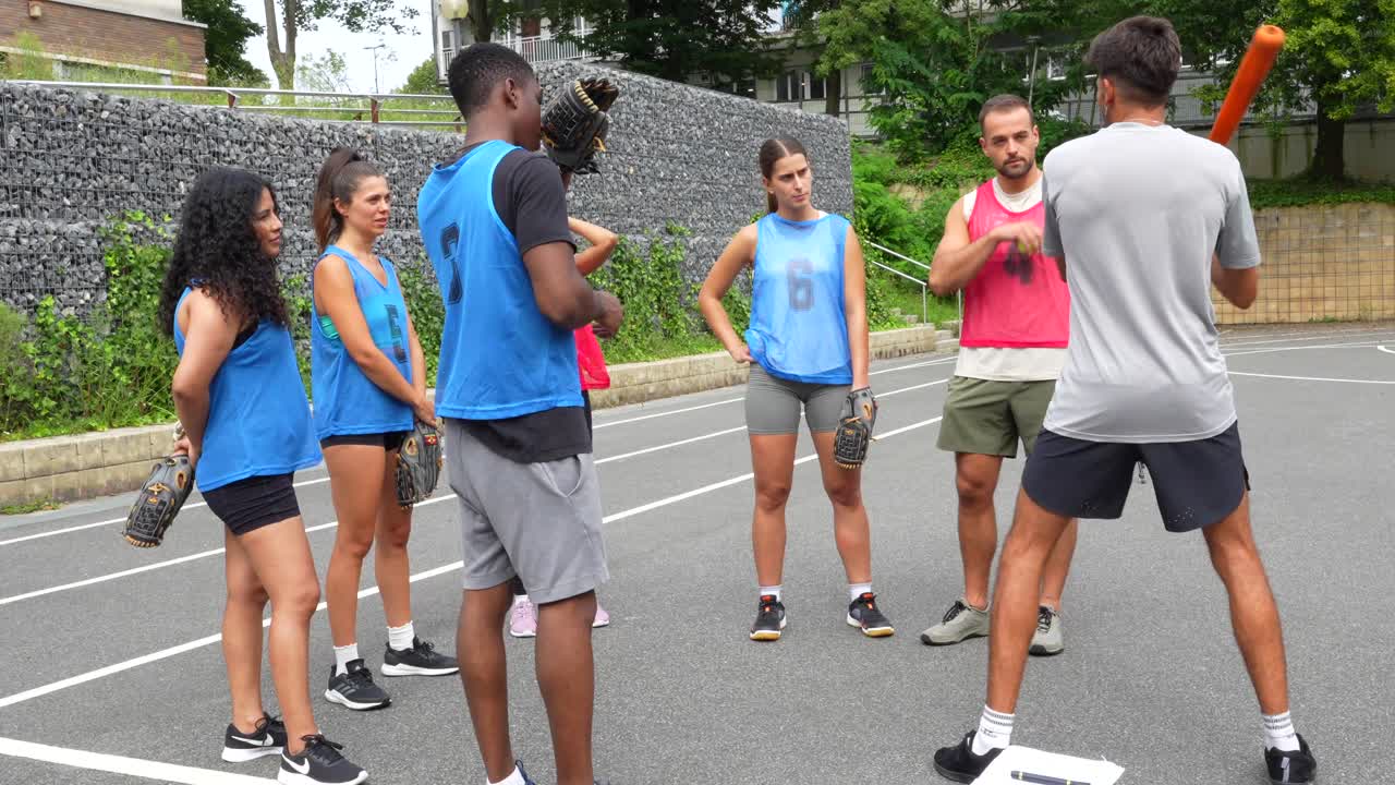 Group of baseball players training with coach