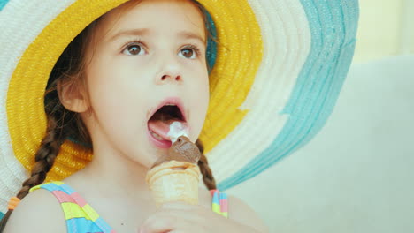 A-Nice-Girl-With-Pigtails-Is-Eating-Ice-Cream-Sits-In-A-Deckchair---Rest-On-The-Sea-Concept